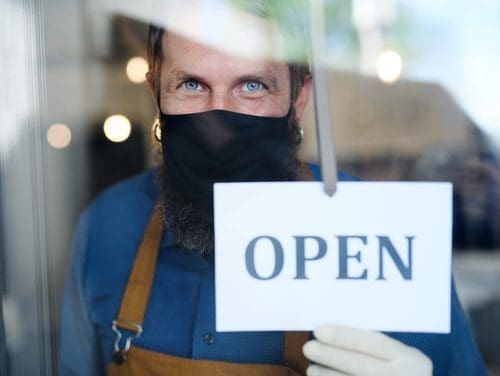 Man with open sign for coronavirus post