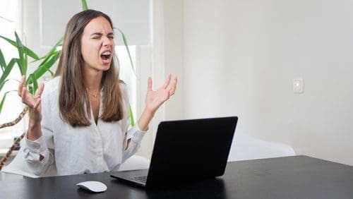 Woman laptop for COVID angry post