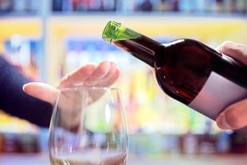 Woman refusing alcohol for Dry January post